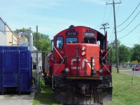 In the west side of Brampton, far away from the industrial areas around Bramalea and Hwy 410, two CN GP9RM's pause south of Nelson Street as crewmembers couple onto a string of boxcars at the Georgia Pacific plant. Built in 1949, the factory at Queen & McMurchy was originally home to the Dixie Cup Company (once sporting a giant Dixie Cup on the roof) and as of 2006, was the last customer in downtown Brampton to use rail service. About a year or two later, the switch to the weed-infested Dixie Cup Spur was removed during triple-tracking for the Georgetown GO expansion and was never reinstalled: after almost 60 years, the last rail customer in downtown Brampton switched to trucks.