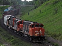 Struggling up the hill at Beare CN 4784, 4134, and 4710 are just now getting a handle on their train. Minutes before it looked like they'd stall as 4710 was loading at 40amps and the leader was in the short time, however a second trip back by the conductor seemed to do the trick as they told the RTC they were getting 800amps out of her. This would have been to the releif of YB, as the only other option would have been to have 372's power cut off at McCowans and pull the stalled 570 back up the hill. 1825hrs.
