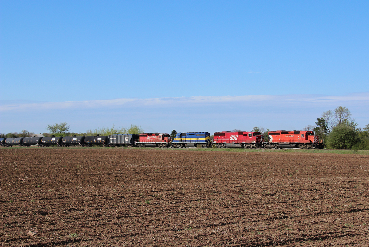 CP 6050 takes charge of CP 640 as they glide through a feild in Progreston. Trailing in the consist was SOO 6058, DME 6368, & CP 5965.