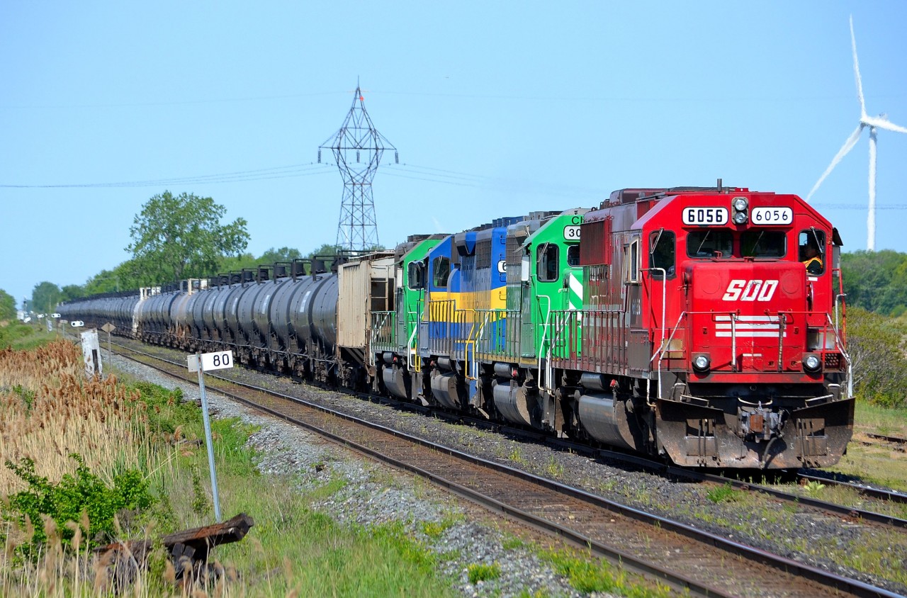 CP 642 led by SOO 6056 along with a pair of CITX and an ICE, proceeds in the Tilbury siding to the east switch where it will wait for 2 westbound trains to pass.