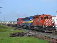 CP 244 led by a nice all EMD lashup, heads eastbound thru Tilbury on a sunny morning.