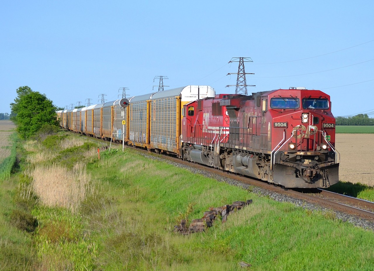 CP 147 led by CP 9504 & SOO 6061 heads westbound towards Tilbury as it passes the block signal at mp 77.4