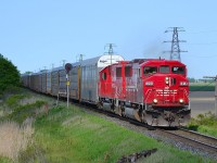 CP 147 led by SOO 6058 and CP 6228 (former SOO 6028), heads westbound into Tilbury as it passes the block signal at mp 77.4