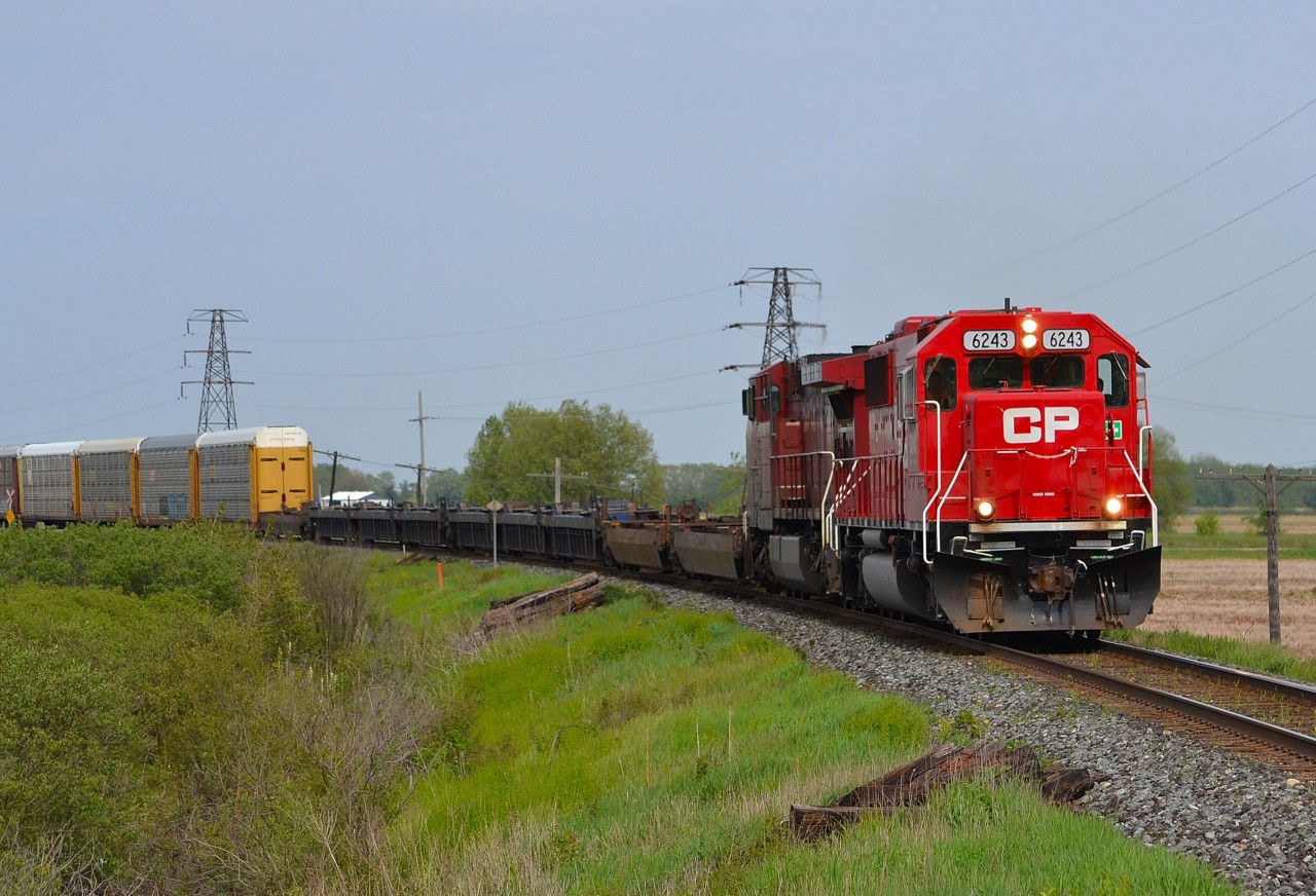 CP 141 led by fresh rebuild 6243, rounds the bend westbound into Tilbury on its way towards Windsor.