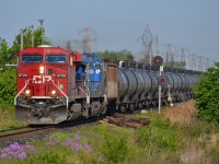 CP 640 an ethanol train with a CP/CEFX lashup, charges eastbound past the east siding switch in Tilbury on a sunny morning.