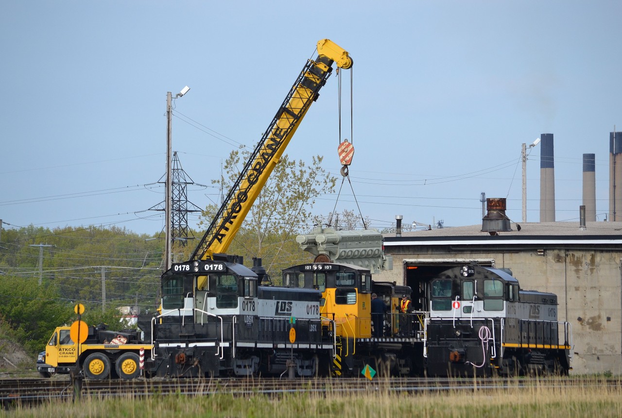 Workers from Lambton Diesel in the process of installing a new engine in ETR 107