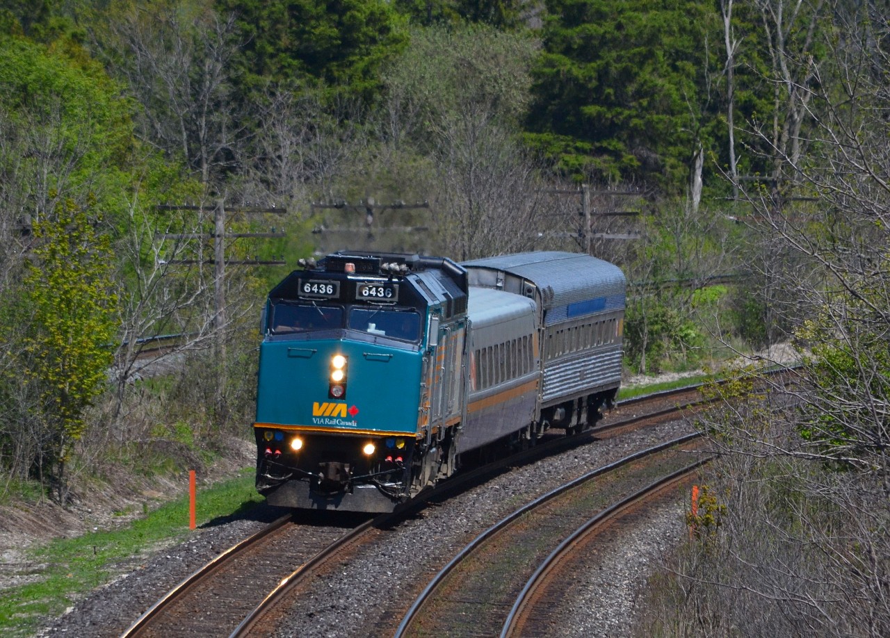 VIA 85 led by rebuilt 6436, rounds the bend at the Denfield Bridge on its way to Sarnia.