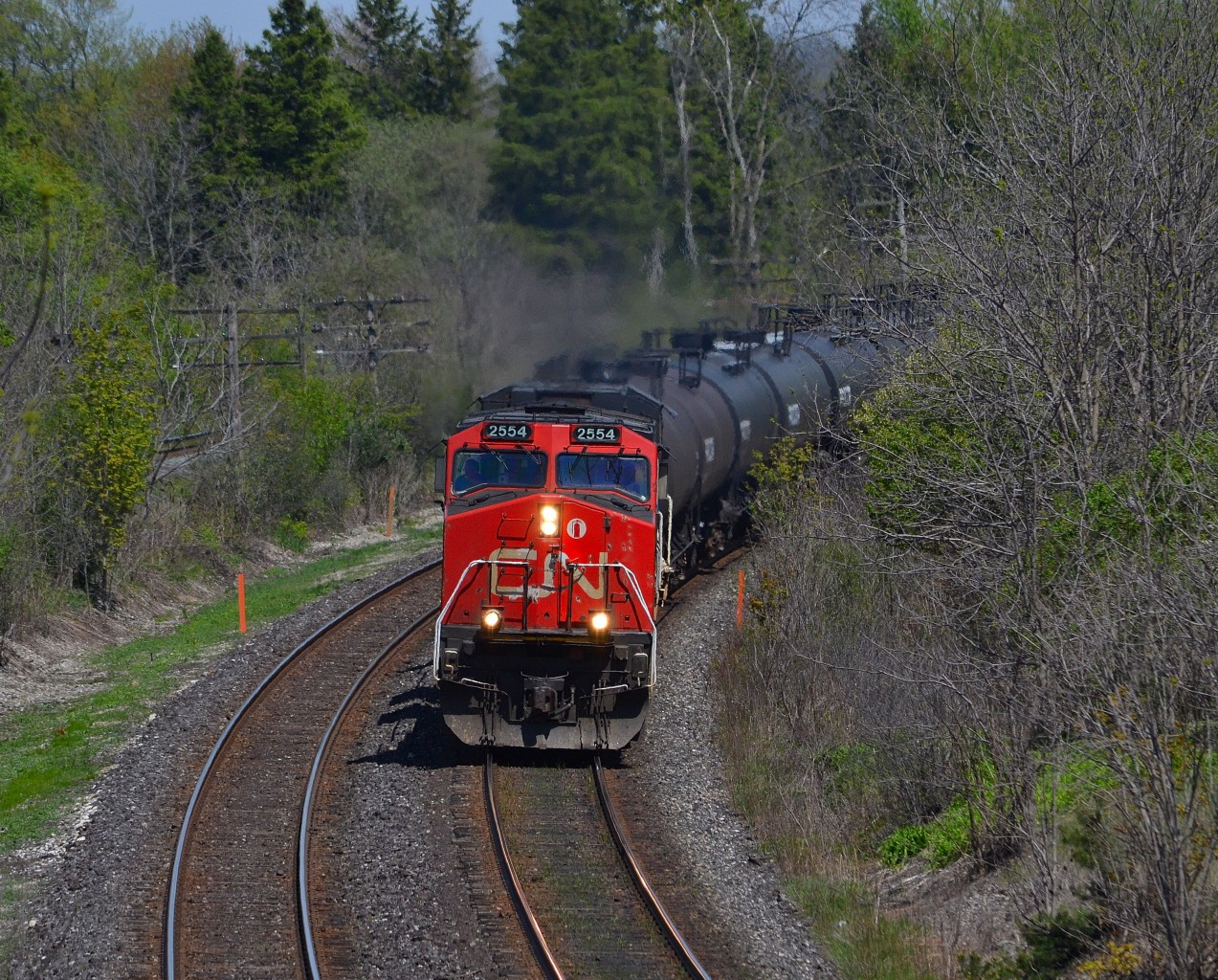 CN 331 led by CN 2554 & BCOL 4650, rounds the bend at the Denfield Bridge after just departing London.