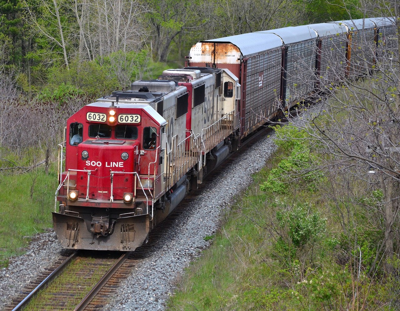 CP 147 led by a pair of SOO SD60s, approaches the Denfield Bridge after just departing London.