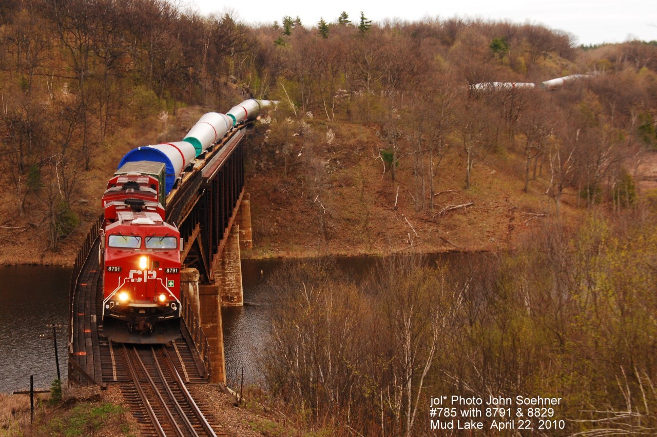 CP #785 \"Darcy the Dragon\" wind tower loads lead by 8791 & 8829 at Mud Lake Trestle, Feldspar, Ontario, April 22, 2010