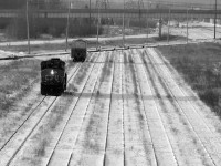 Winter is a lonely time to railroad in Thunder Bay. The crew of the 07:30 Neebing job backs their SD40-2(W) 5279 down through the empty D yard to grab a solitary car switched out from ConAgra Malt by CP in the early overnight hours.