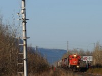 The old signal mast that once stood and protected the diamond between the CN Kashabowie and CP Nipigon Sub sits forlorn and dilapidated. Signal-less, its ladder bent out of shape over the years it once governed eastbound movements on the former south track. Today the former north main is what remains, trains like the one approaching, the daily Fort Frances- Thunder Bay freight A436, led by CN 2109 now governed by a dwarf signal just out of the frame on the right hand side of the picture.