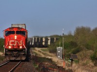 CN 115 with 5709 and IC 1029 round the curve and across the cut arm trestle.