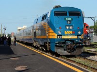 VIA 84 arrives into Kitchener under the watch of eager passengers. 