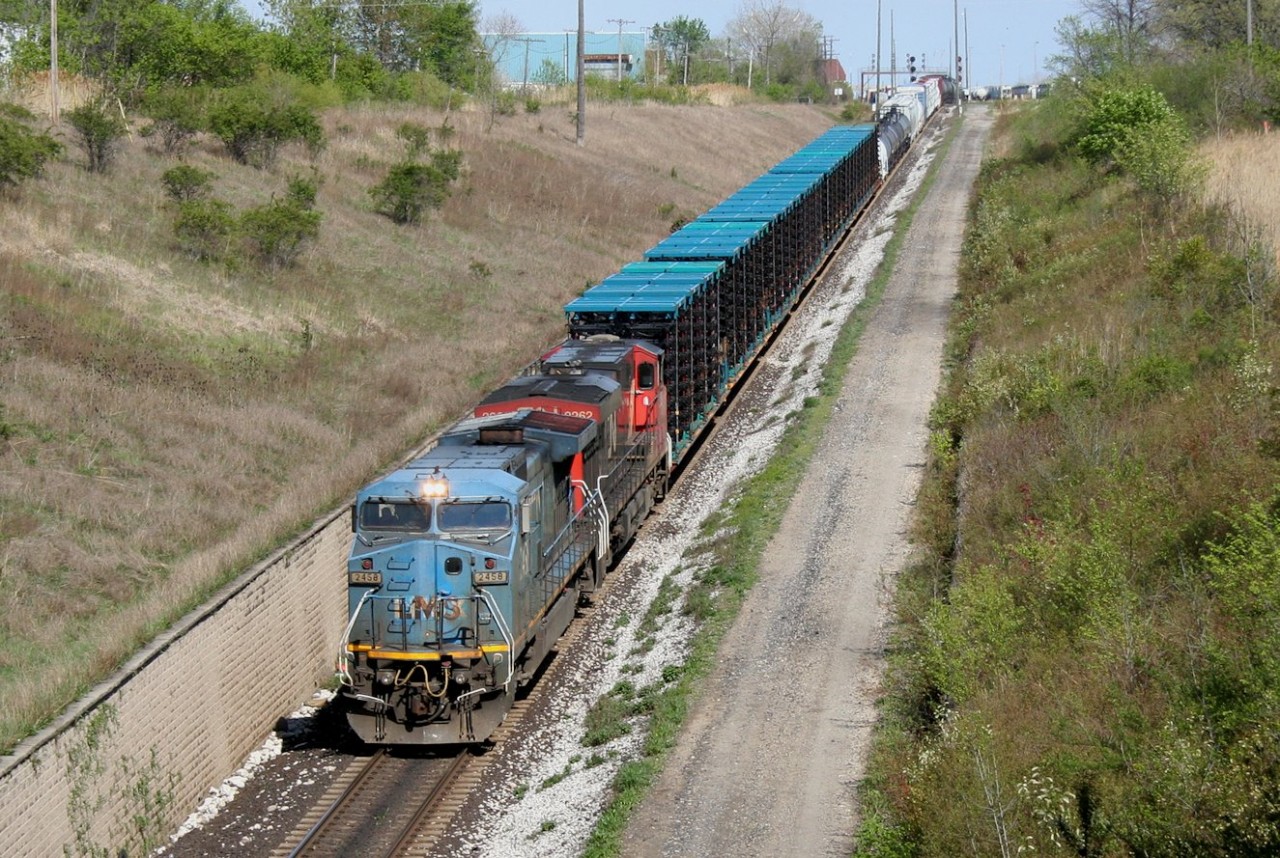IC 2458 leads CN train 501 downhill from Sarnia to the international St. Clair Tunnel to Port Huron, Michigan.