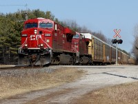 CP 147 approaches Woodstock/Coakley as the conductor gives a nice wave. 