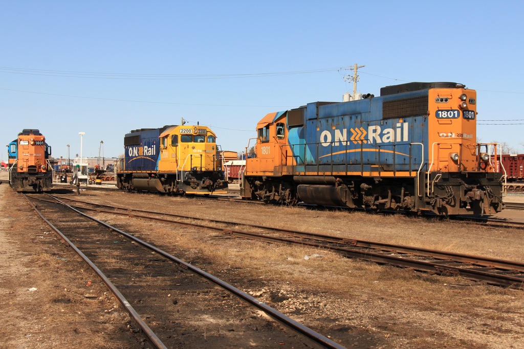 1601, 2200, and 1801 rest at Ontario Northland\'s Cochrane passenger yard awaiting their next assignments and an uncertain future.