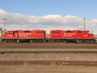 GP38-2s 3125 and 3078 bask in the sun at the north end of Alyth yard.