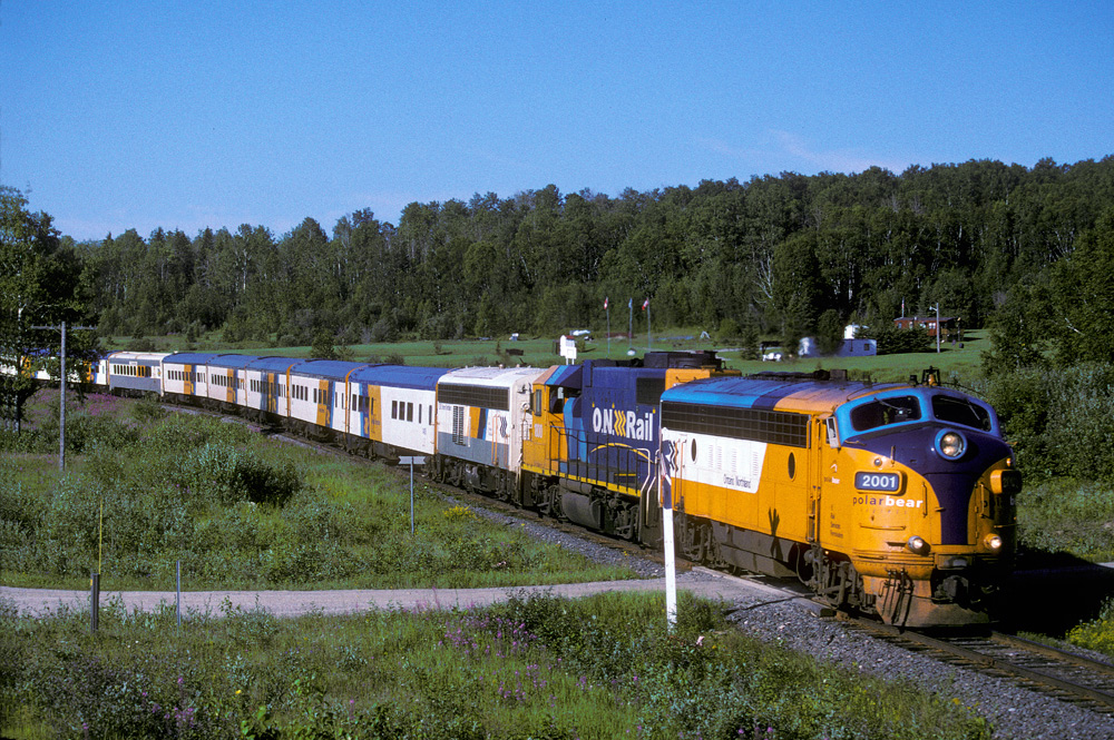 On one of the few sunny days during the summer of \'03 the Polar Bear Express is headed northwards. This is about 5 miles north of town.