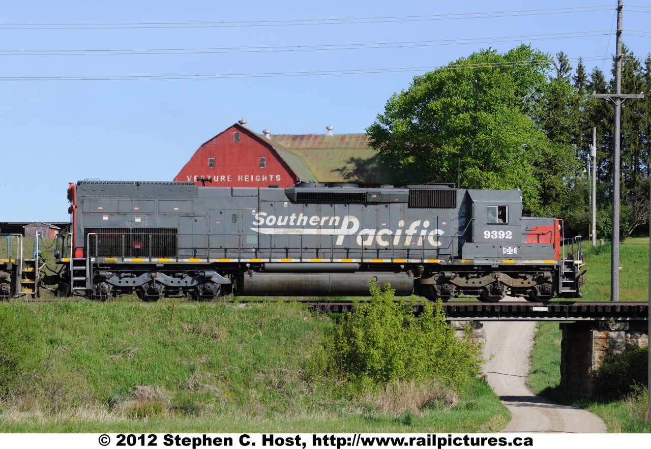 SP 9392... wait, GEXR 9392 east is passing a farm just east of Guelph in the wee morning hours of a beautiful spring day.