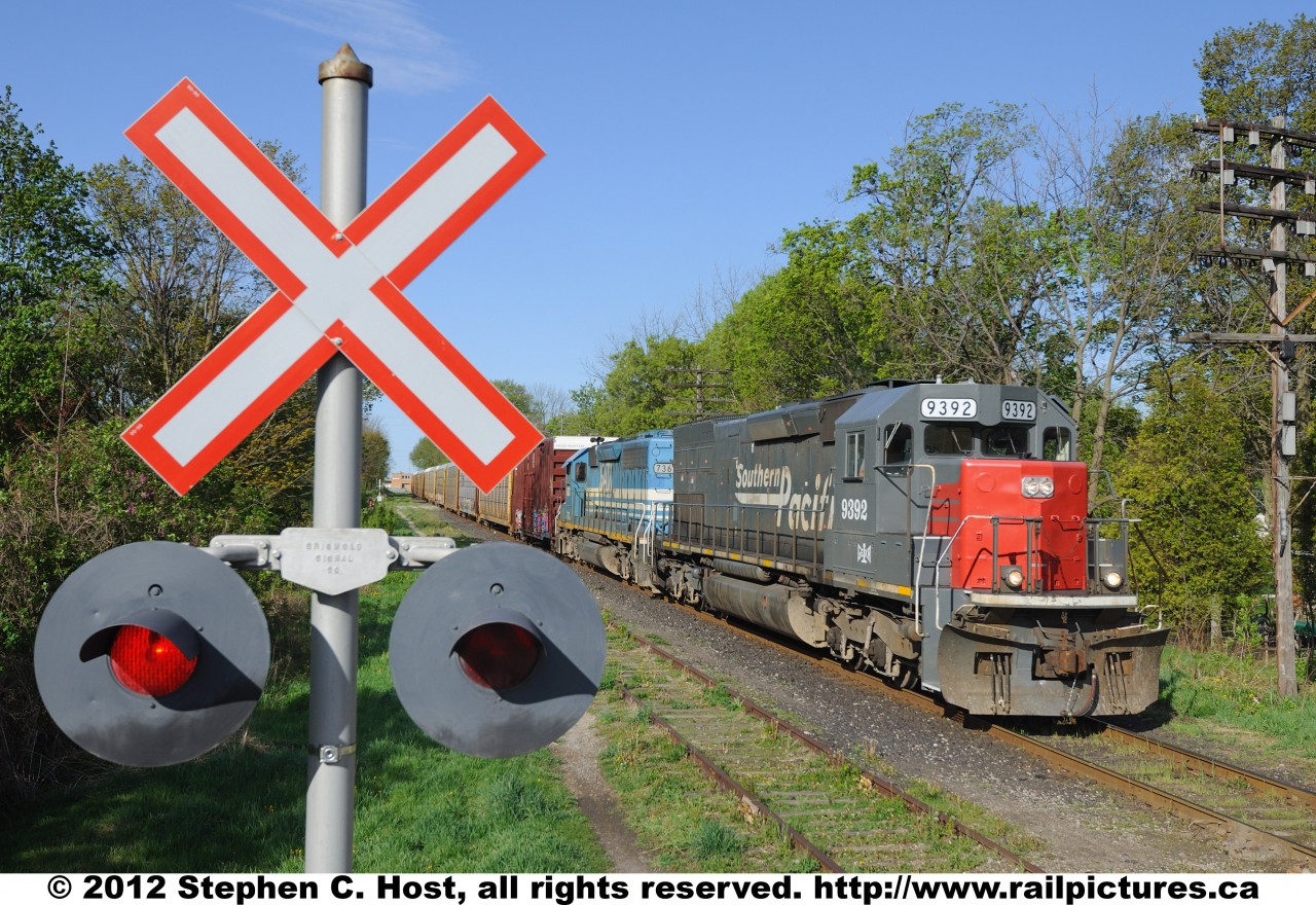 Southern Pacific lives in Canada!  Train 432, GEXR 9392 east, formerly SP 9392 heading to Toronto\'s Macmillan yard with a load of new Autos from the Toyota Cambridge assembly plant plus other freight on a nice spring day.