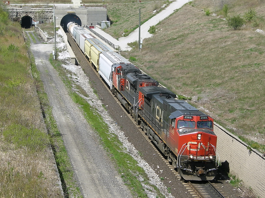 CN 394 pulls out of Paul Tellier Tunnel, with CN 2569 & CN 8925. The Units are leaning towards the wall, and makes me wonder how the foundation of the track is right now...