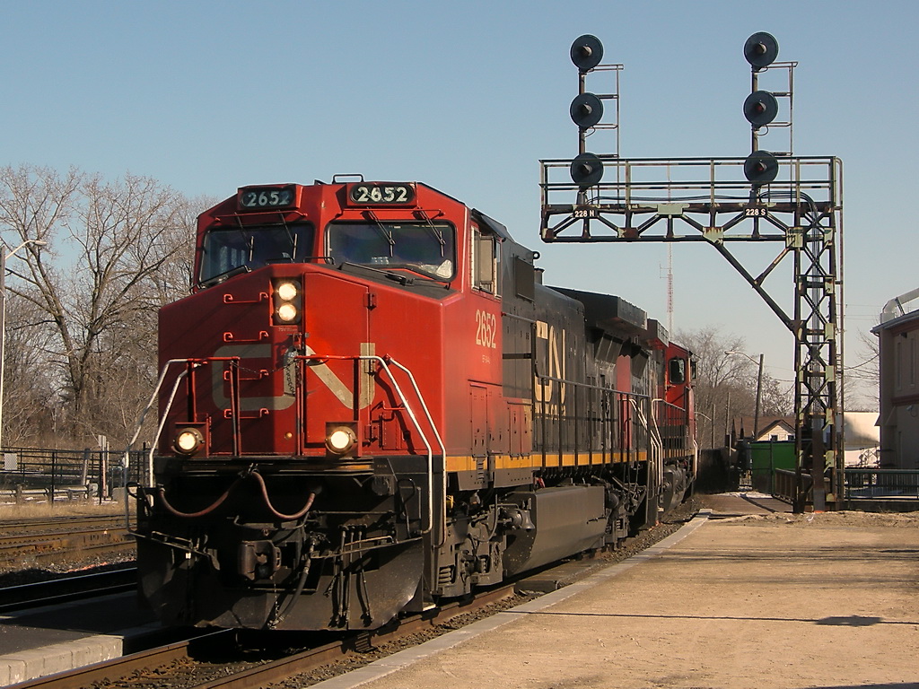 CN 2652 glides pass the Signal in Brantford. Look at the banged up number boards on the unit.
