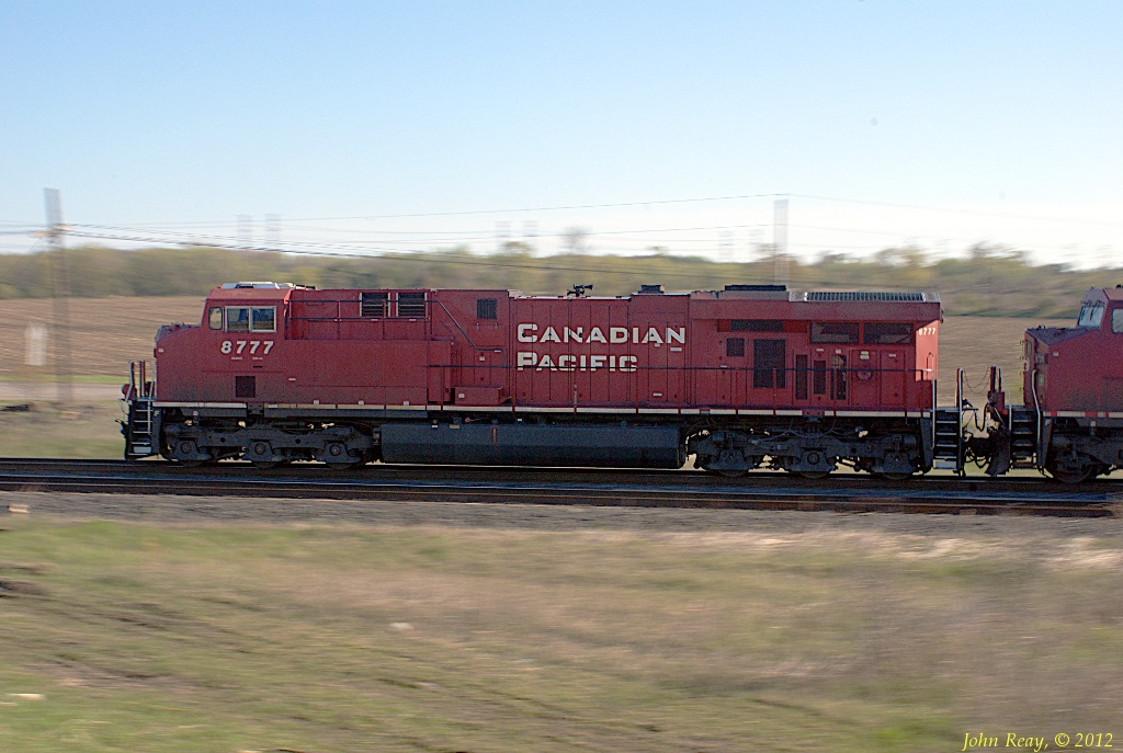 CP ES44AC 8777 leads train 233 west through Lovekin siding on the CP Belleville sub on Sunday, May 6th, 2012.