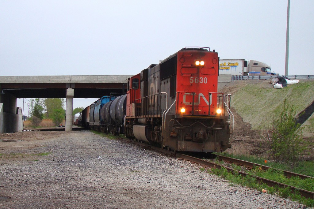 The last westbound revenue train over the Canada Southern between Fargo and Pelton glides slowly under Hwy 401 on a cloudy Tuesday afternoon. The next day train 438 would head out of Windsor over the CASO for the last time.