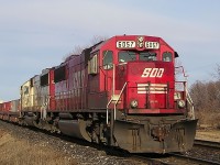 SOO 6057 idles in the Siding, after coming out from downtown London, and having to sit downtown for over 1.5 hours, after hitting a St Patty's Partier car, and blocking the entire downtown during Rush hour. The crew was ok to bring the train up to the Lobo Siding after they were given the all clear, but would not take the train to Windsor