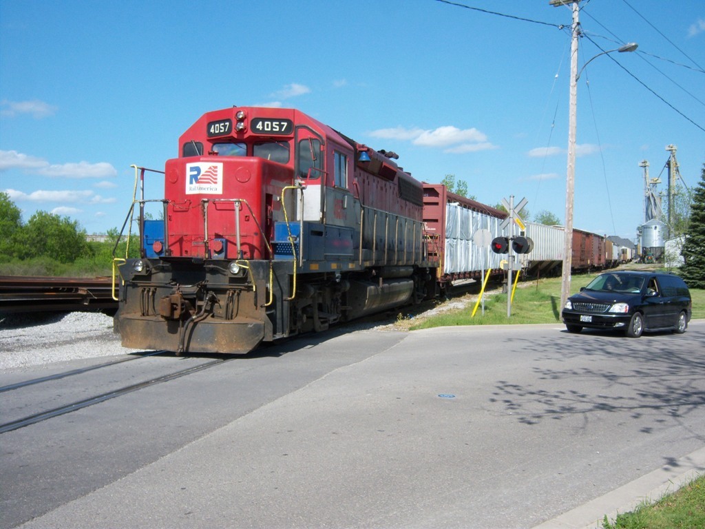 RLK 4057 shoves its train across Orkney Street in Caledonia Ontario on Rail America's Southern Ontario Railway