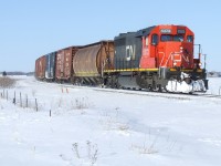 CN 514 rounds the curve with a dozen cars and a former UP sd rebuilt by CN PSC shop in 1994. 
