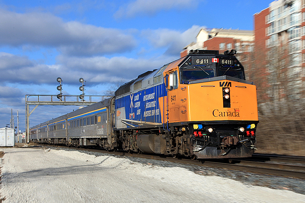 This zoom-pan from a few years back is still one of my favorites primarily because of the vivid colors of the VIA OLS unit. Shot from the west parking lot of Oakville Station this shows the third main under construction. The signal bridge no longer exists, having been replaced with one afew hundred yards to the west.