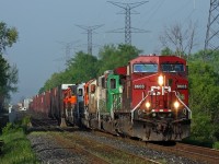 The morning mist still obscures the Niagara Escarpment in the background as CP 247 drops into the Hornby Dip with an eclectic mix of power behind the big GE.