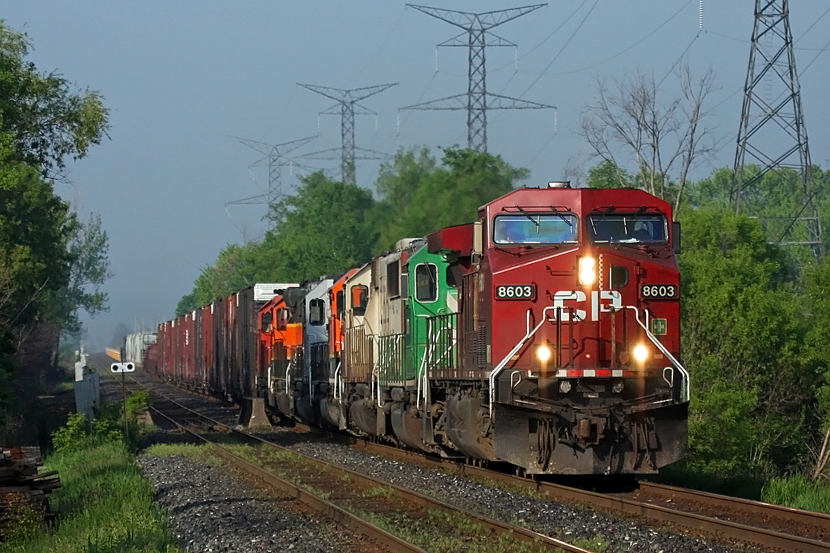 The morning mist still obscures the Niagara Escarpment in the background as CP 247 drops into the Hornby Dip with an eclectic mix of power behind the big GE.