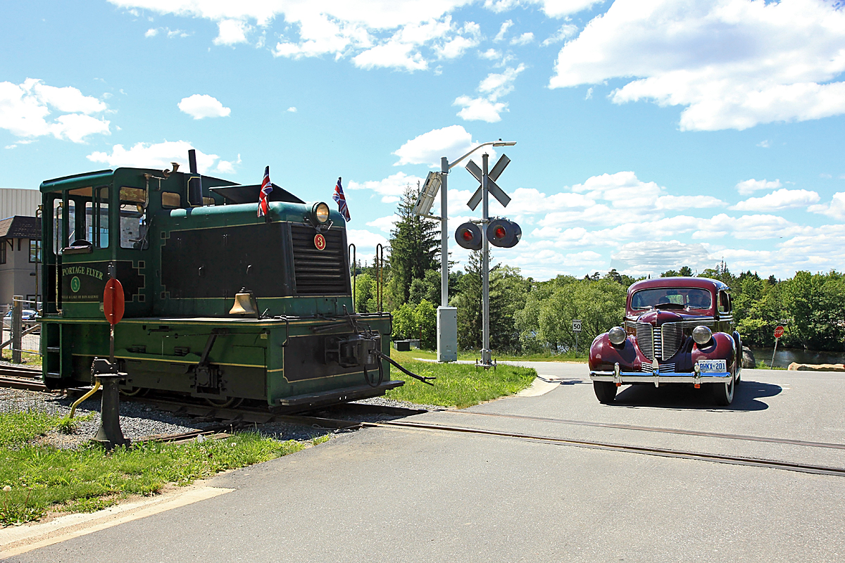 People might think I'm nuts, but there's a reason I always try to carry a camera in the cab with me. It's cuz you never know when it might come in handy. Like when someone in a 1938 DeSoto taking an elderly couple on a drive around town for their 50th Anniversary might drive by, and agree to pose at the crossing for you. That, or the slimmest chance in hell that Shania Twain might come around and ask for a cab ride!