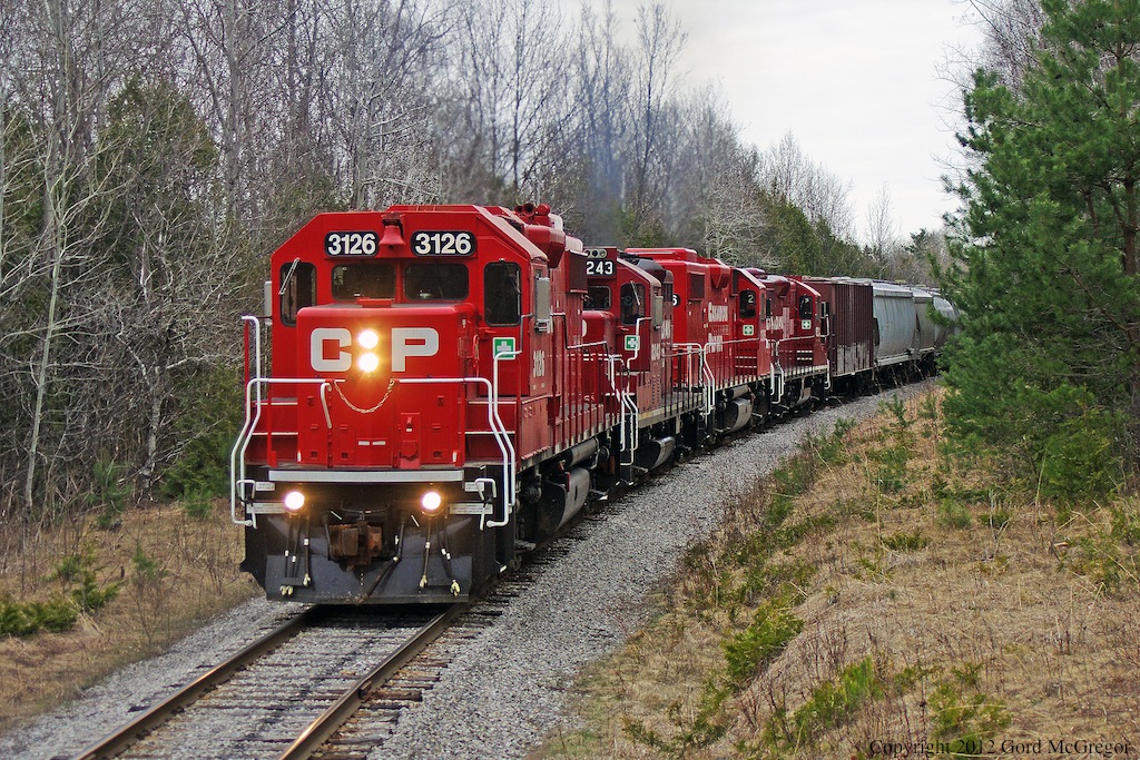 An assortment of power rounds the curve west of the former junction of the GBS in Dranoel Ontario.