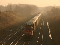CN 332 grinds up the grade from Hamilton as VIA 95 waits at Snake
