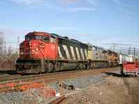 CN 5549, KCS 4019 and WC 7525 power 385 past a foreman at Aldershot East.