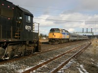 CN 784 a unit train of empty gondolas for Nanticoke idles in the south service track at Paris behind NS 6571, as VIA 73 cruises by led by VIA 6402