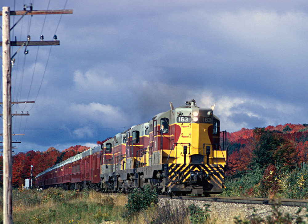 Psgr Extra 163 North has a full train of the "Jessie James" cars near the peak of the fall colour season. The cars were called "Jesse James" account they were old former DRGW built around 1912. The Psgr Extras were a Canyon Turn and were called when the regular trains No. 1 and No. 2 were at full capacity.