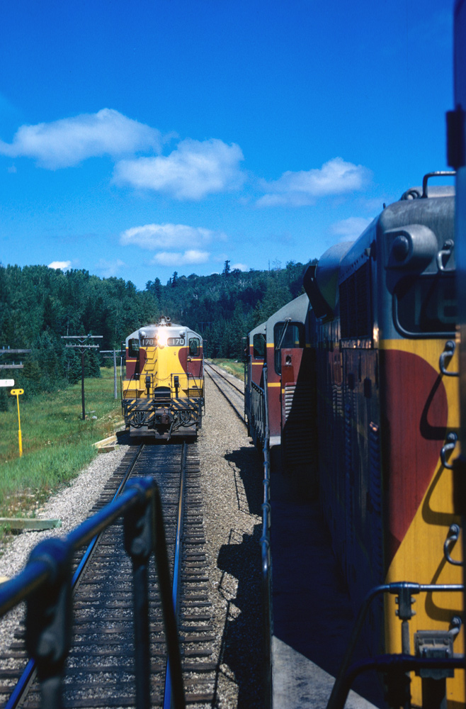 I was making a tour of the line and here No. 1 is taking the siding for No. 2. I had just started working for the ACR so I had to see what the road looked like...even though it was on my own time it was a good trip.