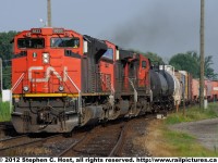 CN 384 emerges from the  Paul M. Tellier tunnel in Sarnia, Ontario, Canada and is on the approach to the CN/VIA Station at Sarnia.