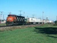 CN 281 rolls through Beaconsfield behind CN 3516 after the Eco Rail unit died.