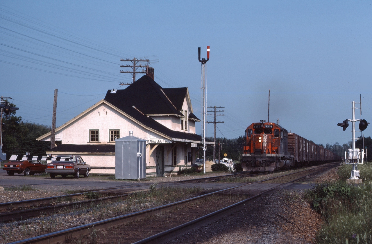 CN 5205 leads an empty grain train through Kakabeka Falls