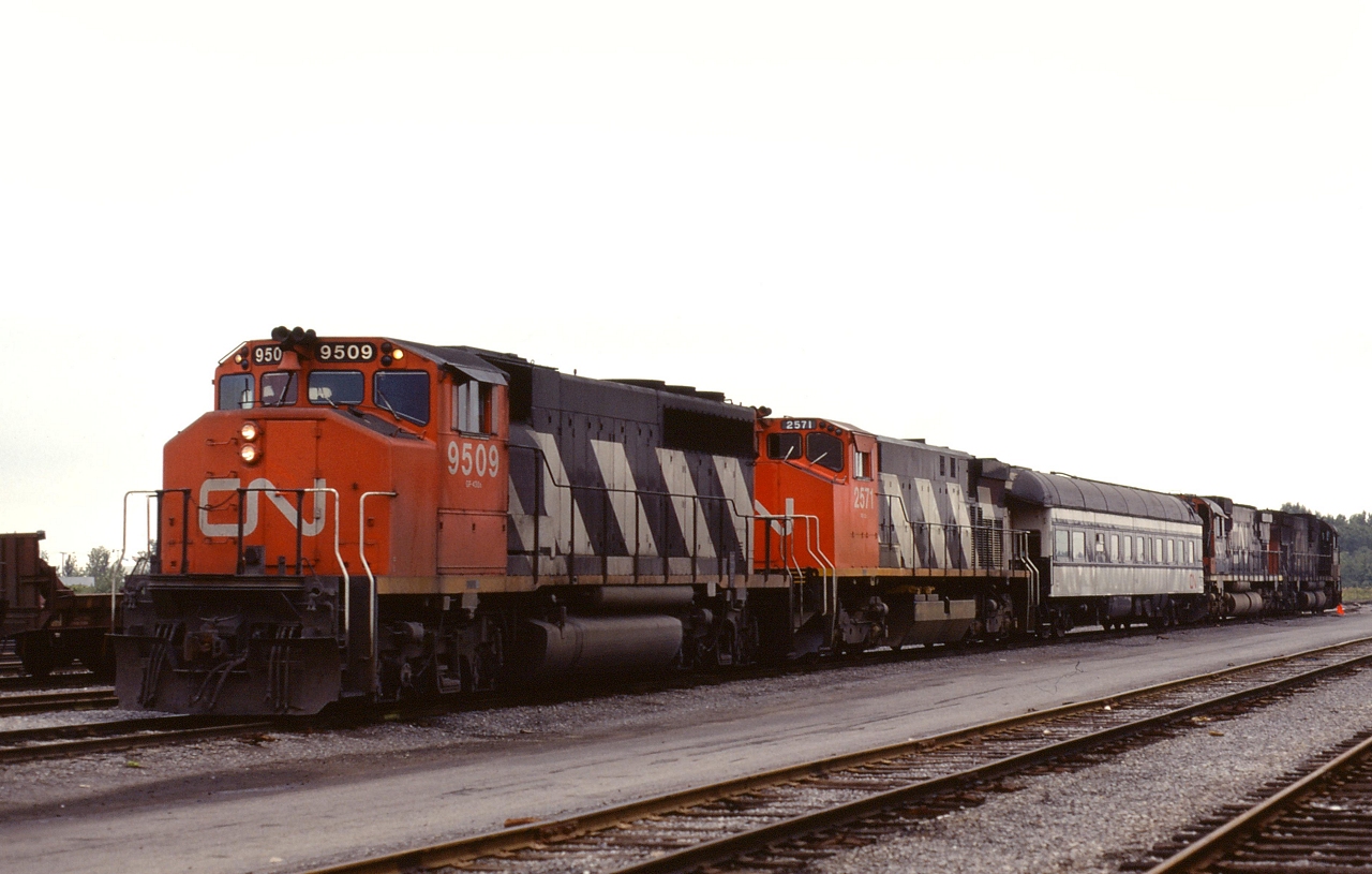 CN 9509 and 2571 are undergoing wheel slip testing, with a dynamometer car and two M630's providing the load through dynamic breaking.