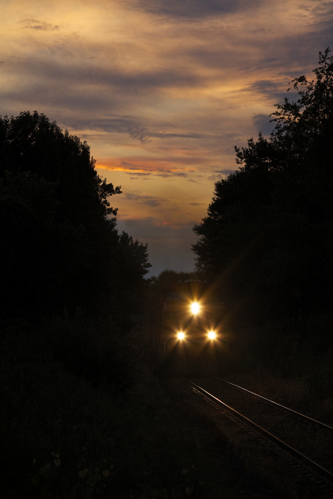 As darkness falls and the last light of day fades a pair of CP General Electric locomotives descend the grade into Hamilton, Ontario with train 254.