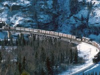 A westbound local is crossing the Little Pic River bridge on a very cold December day. Compare with Chris Wilson's photo taken at the same place 45 years later - the trees certainly have grown quite a bit.
