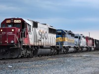 CP 640 led by SOO 6026 and an all EMD lashup, waits in the Tilbury siding for a couple of westbound trains to pass by. Darkness was setting in fast at the time.