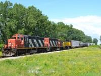 CN 439 heads westbound thru Jeannettes Creek with ETR 107 in the consist after receiving a new engine at the Lambton Diesel shop in Sarnia.